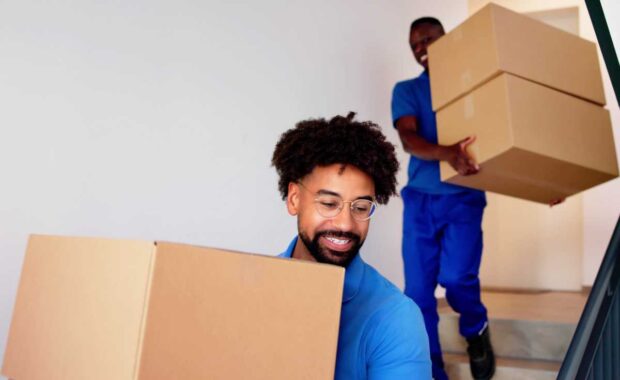 Movers Carrying Boxes