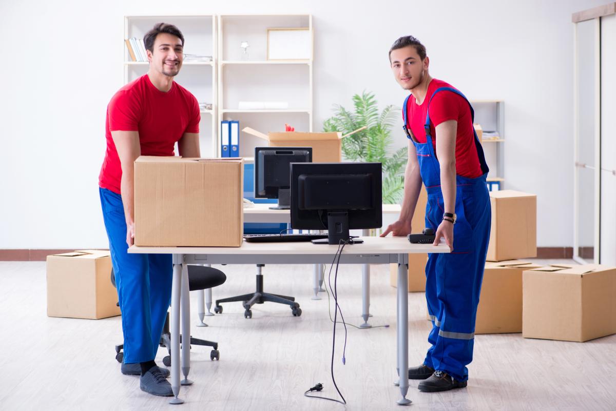 Commercial Office Movers Picking Up Desk