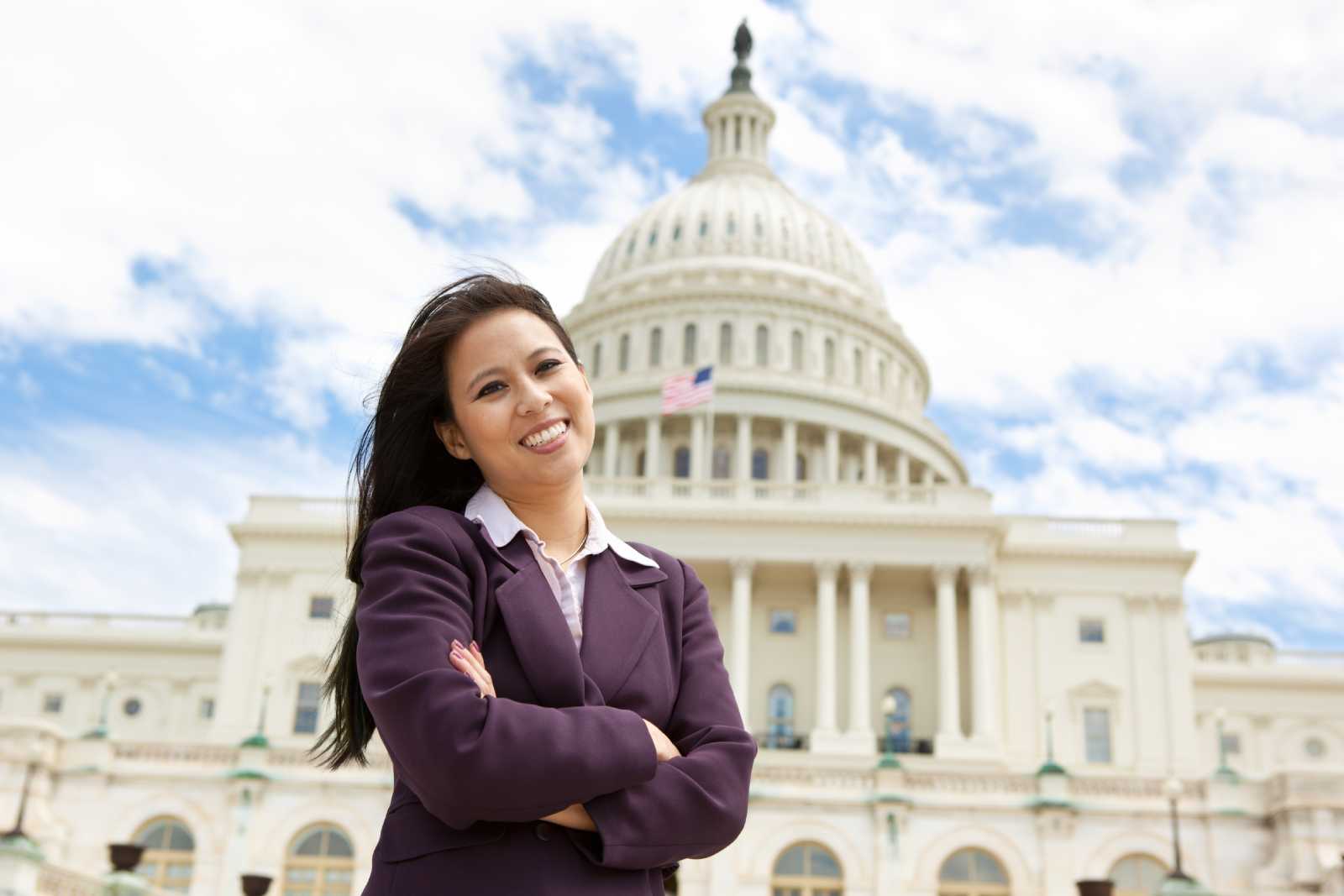 Government Employee Standing In Front Of The Capital