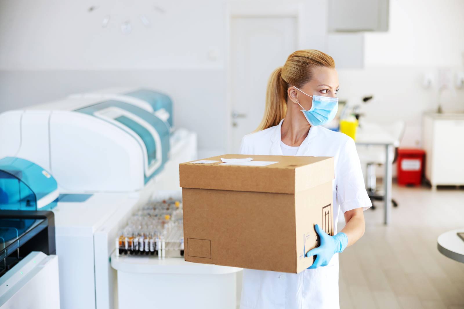 Professional Laboratory Mover Walking With Moving Box