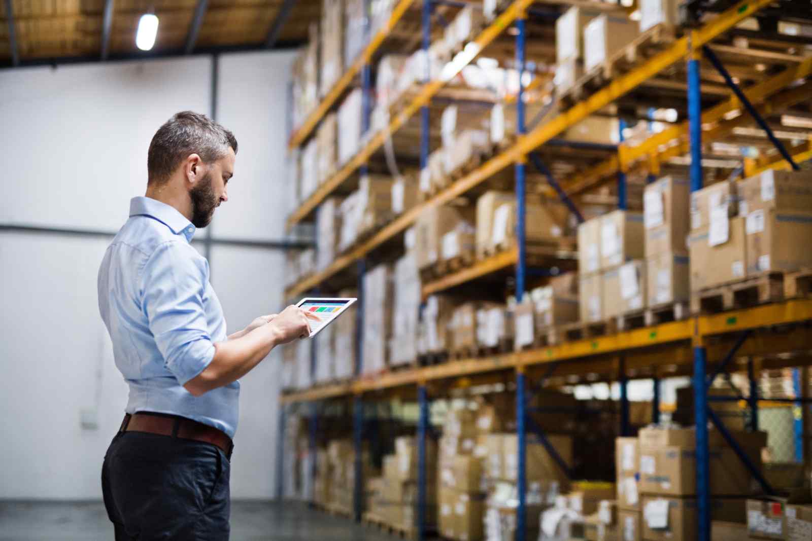 Warehouse Manager Taking Inventory Before Move