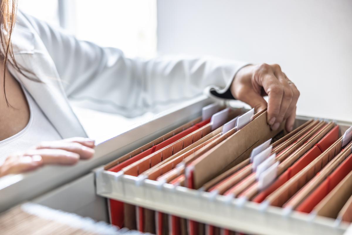 Woman Going Through An Organized File System
