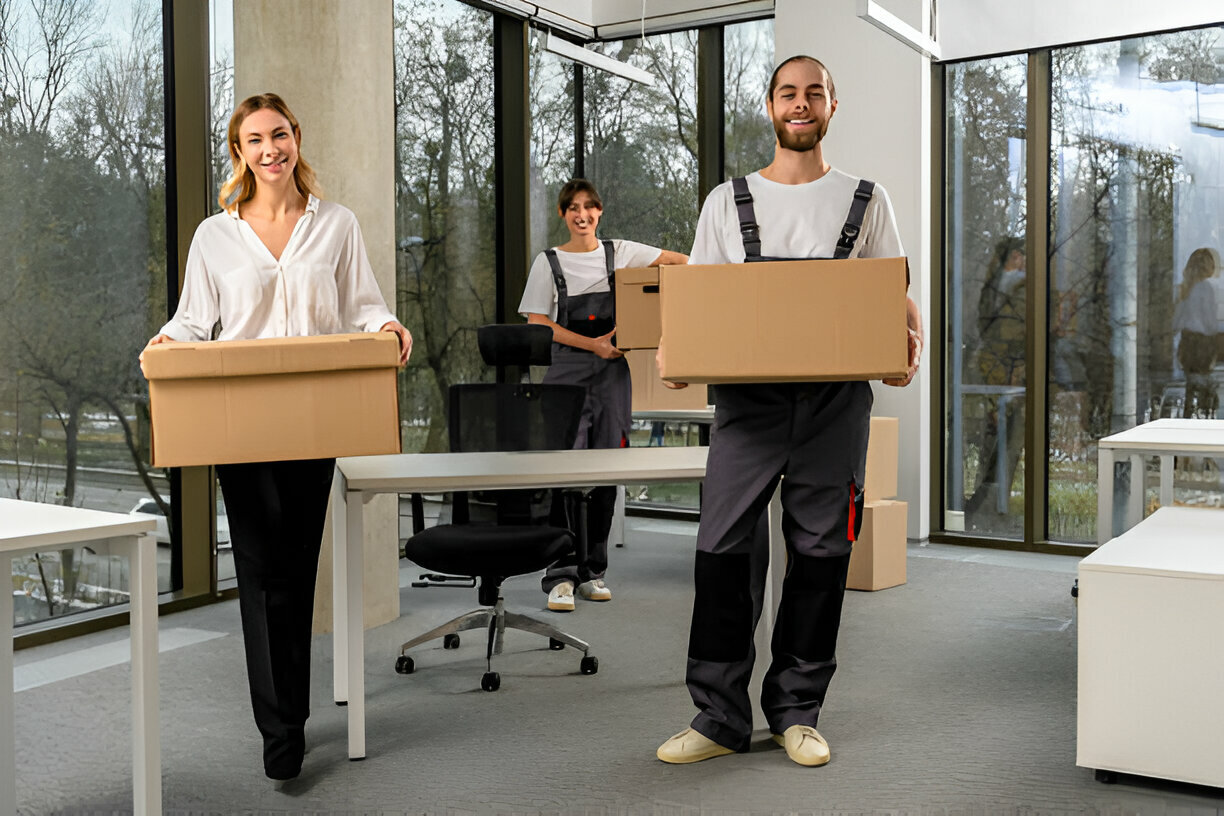 commercial moving professionals helping employee carry boxes out of their office