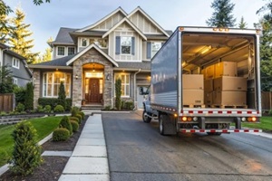 moving truck outside a modern home