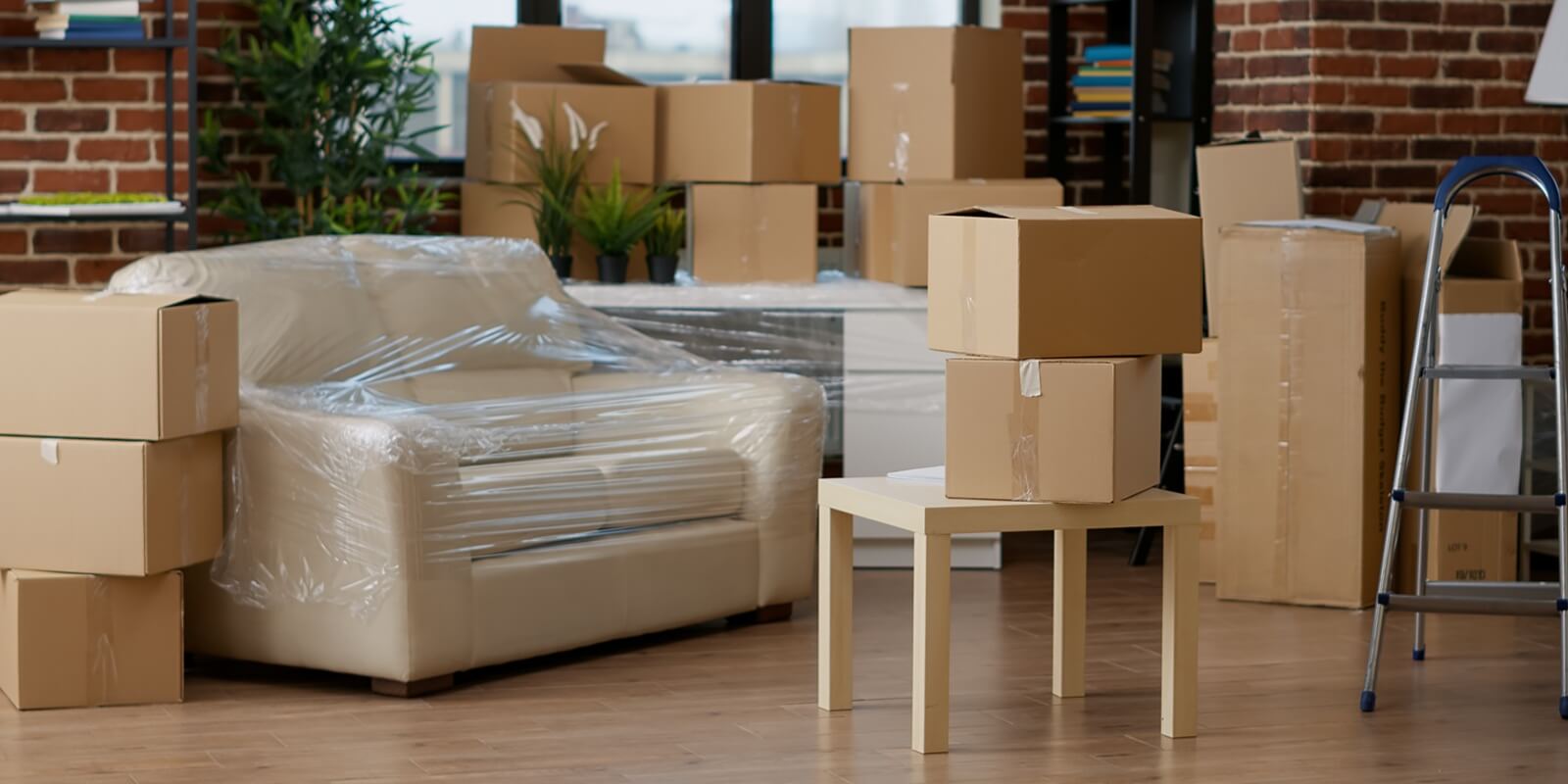 no people in empty living room apartment with carton boxes on stack