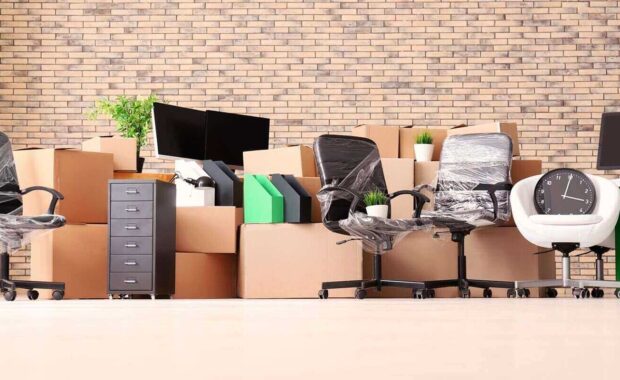 carton boxes with stuff in empty room