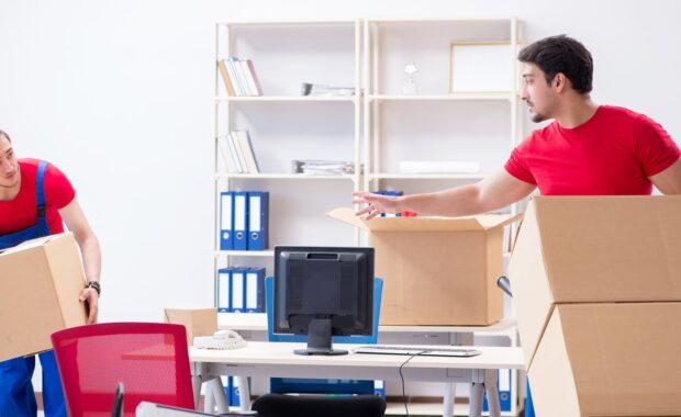 two contractor employees moving personal belongings