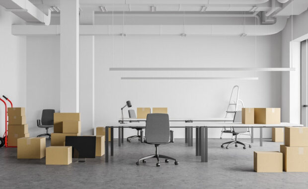 boxes in open space office, moving concept
