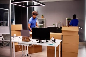 man packing and moving office