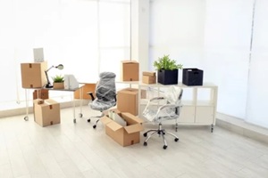 moving boxes and furniture in new office