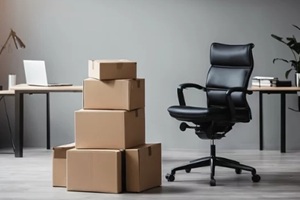 cardboard boxes and office chair in an empty office room