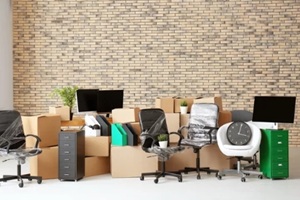 carton boxes with stuff in empty room