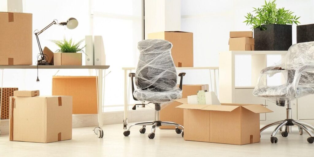 moving boxes and furniture in new office