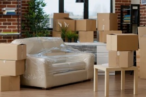 no people in empty living room apartment with carton boxes on stack