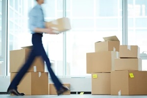 office moving concept with blurred worker