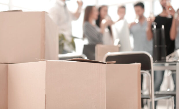 business background and cardboard boxes in the new office