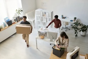 high angle view of business people packing things and furniture while moving in new office