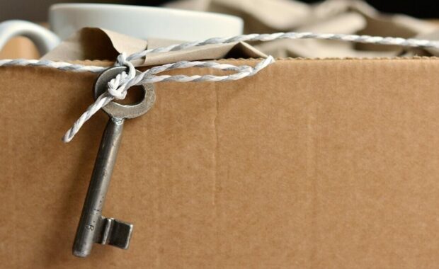 key hanging out of a box